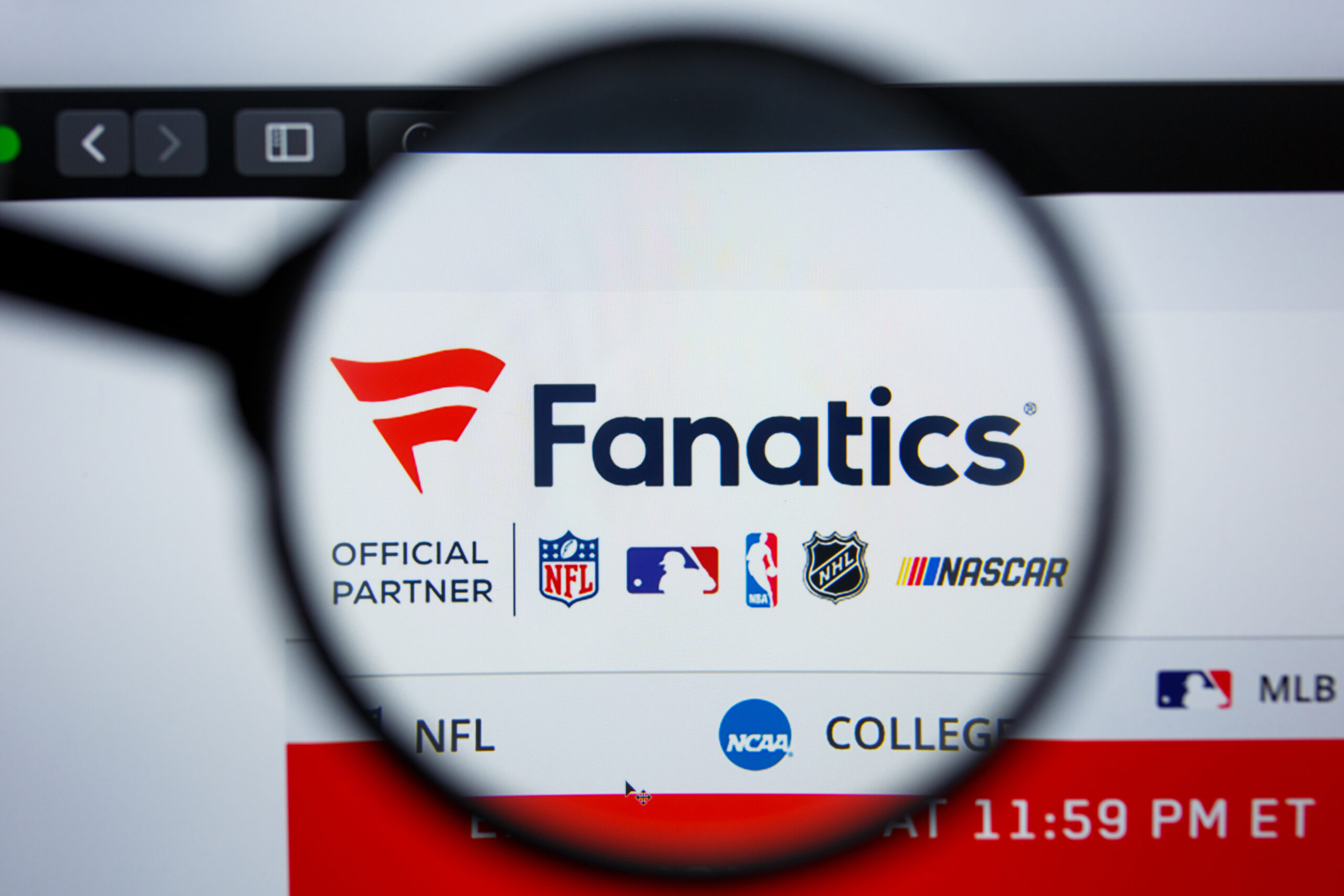 Fanatics website logo under a magnifying glass