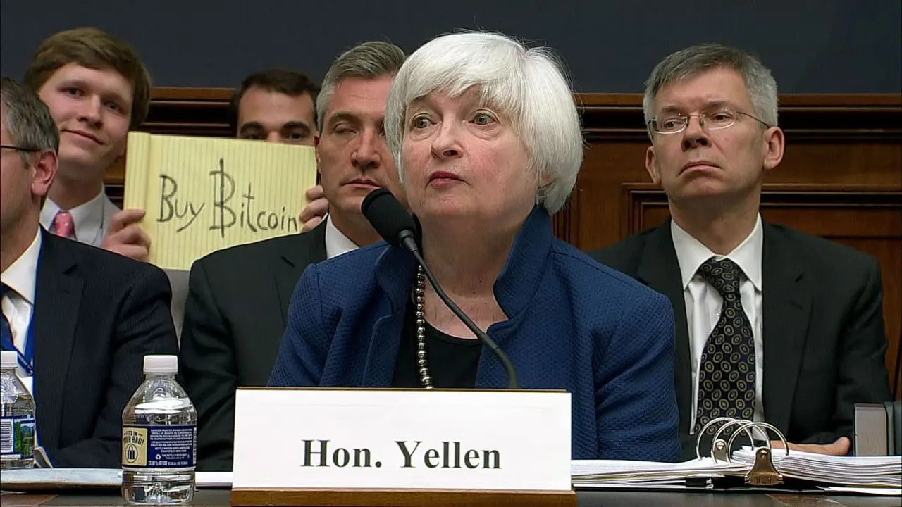 "Buy Bitcoin" sign held up while Janet Yellen was giving testimony before a congressional hearing